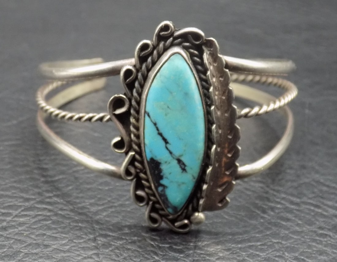 Native American Indian sterling silver and turquoise bracelet: Native American Indian sterling silver and turquoise bracelet. Signed N K as shown in photo. Beautiful colors. In very good original as found condition. Great quality and detail. 6 inches inside circu
