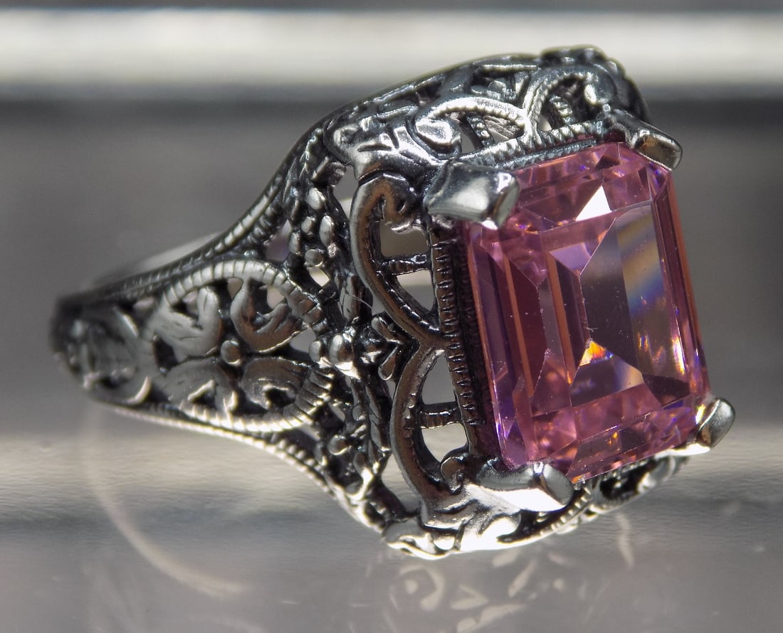 Beautiful 4 ct pink sapphire sterling silver ring.: Beautiful 4 ct pink sapphire sterling silver ring. Lab created. Size 6. For in house shipping, please call Mike at Thriftiques 319-321-0613