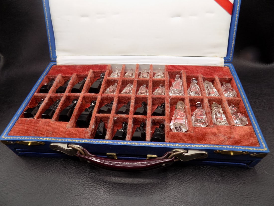 Vintage cut crystal chess set: Vintage cut crystal chess set. Slide out playing board. Beautiful colors. In very good original as found condition. Great quality and detail. Box closed 12 x 6 inches wide. 2 ½ inches tall. 2 pou