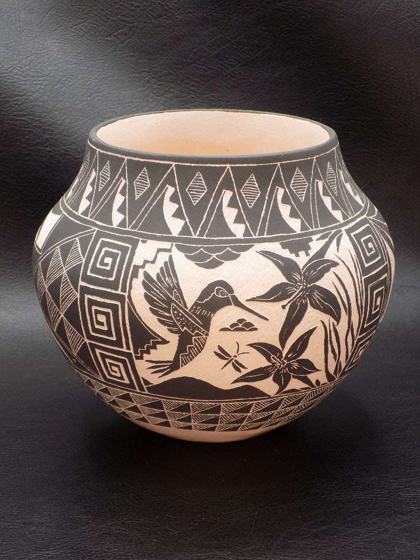 Beautiful Acoma Native American Indian pottery vase: Beautiful Acoma Native American Indian pottery vase. Artist signed Poncho as shown in photo. Beautiful design with humming bird and flowers. In very good original as found condition. Great quality and