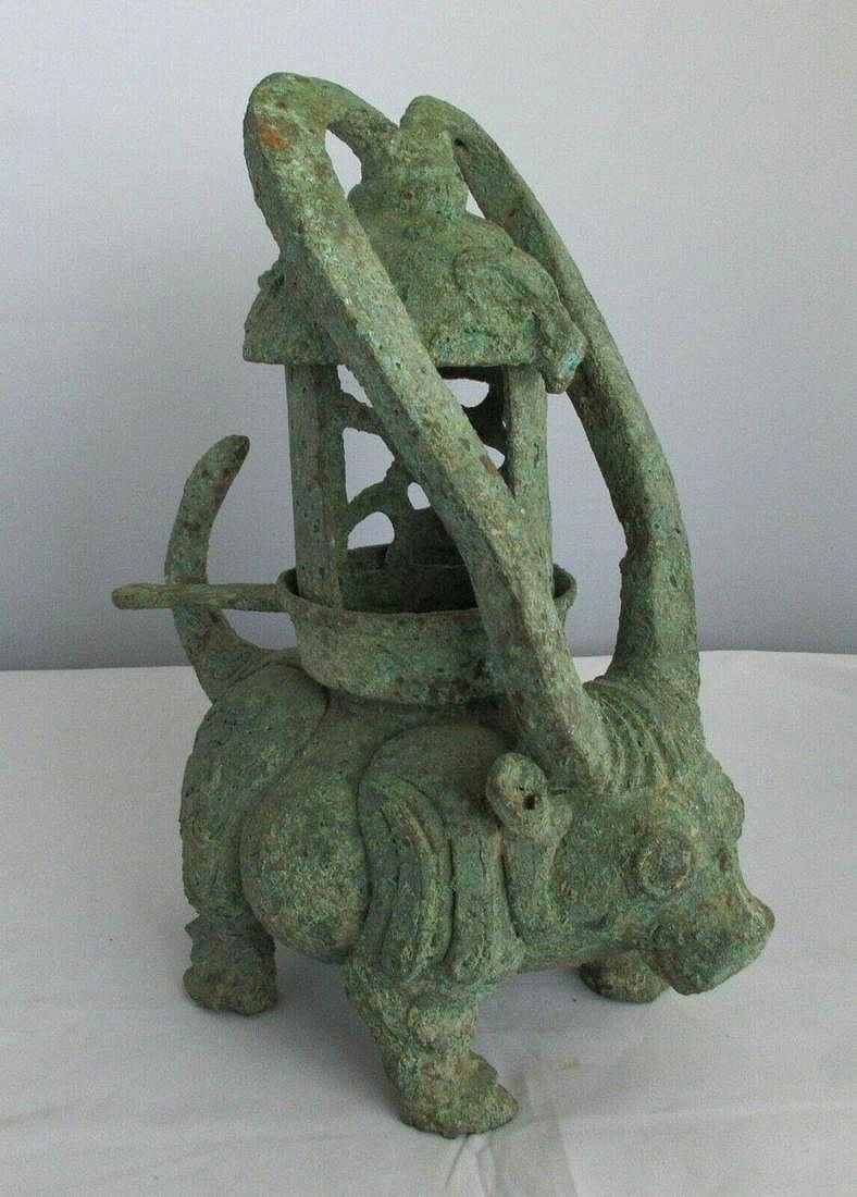 Antique ancient Chinese metal figural incense burner: Antique ancient Chinese metal figural incense burner. Bull or ox holding incense burner. Possibly bronze. Please see photos for condition. 9 ¾ inches tall 7 ¾ long x 4 7/8 wide at top of hor
