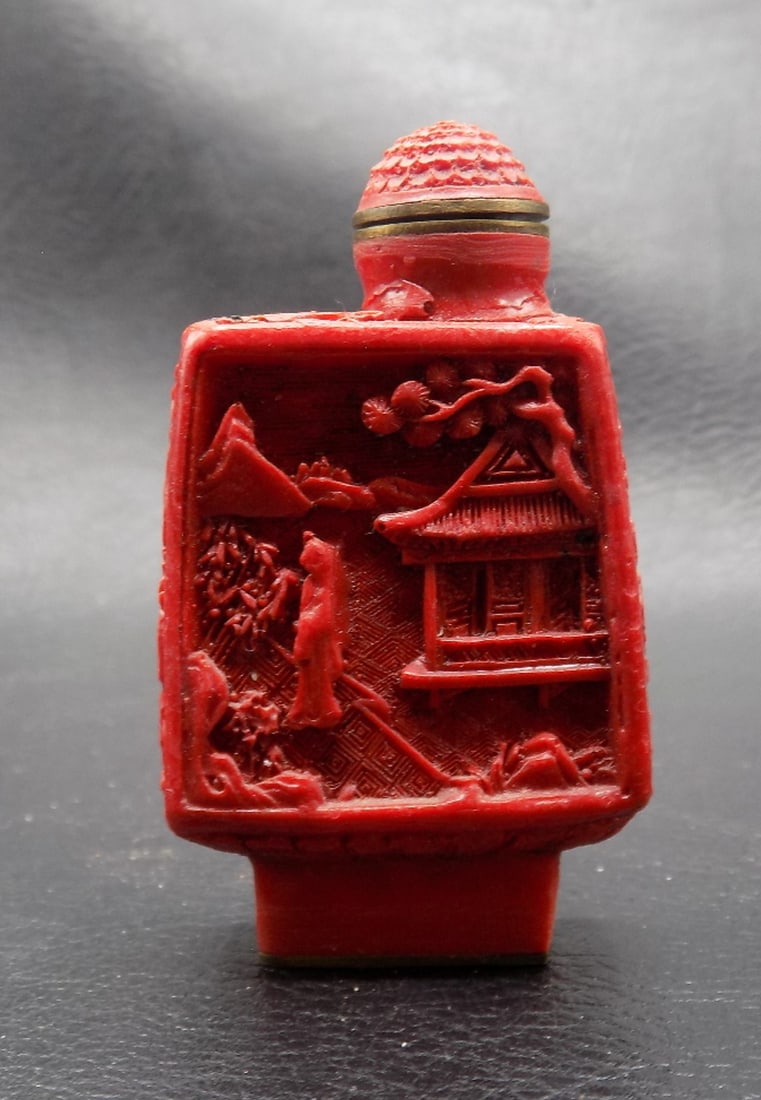 Vintage intricate carved Chinese red cinnabar snuff bottle: Vintage intricate carved Chinese red cinnabar snuff bottle. Marked on bottom as shown in photo. Beautiful color. In very good original as found condition. Great quality and detail. 2 ½ inches tal