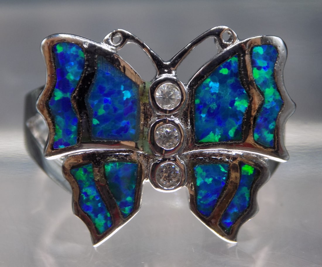 Beautiful inlaid Australian opal sterling silver butterfly ring: Beautiful inlaid Australian opal sterling silver butterfly ring. Size 7. For in house shipping, please call Mike at Thriftiques 319-321-0613
