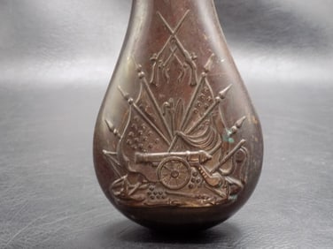 Antique powder flask with Civil War era military weapons
