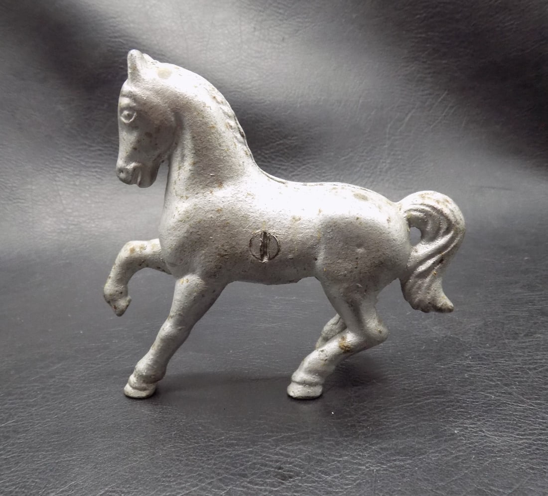 Early 1900s cast iron horse bank.: Early 1900s cast iron horse bank. Made in Canda marked on side as shown in photos. In very good original as found condition. Great quality and detail. All areas showing white is camera reflection. Has