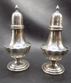 Fancy pair of antique sterling silver salt and pepper shakers