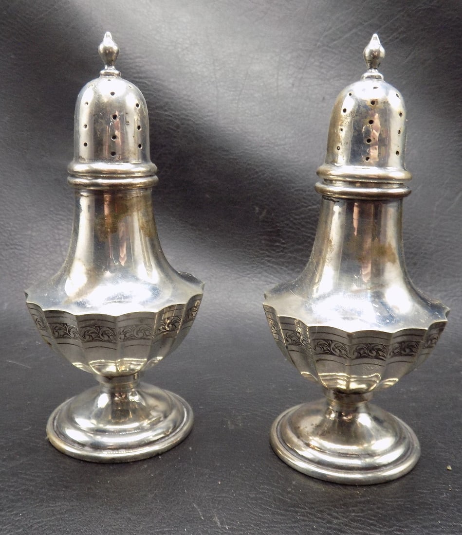 Fancy pair of antique sterling silver salt and pepper shakers: Fancy pair of antique sterling silver salt and pepper shakers.. Marked on bottom RWM as shown in photos. Richard W. Morton. In very good original as found condition. Great quality and detail. 4 7/8 in