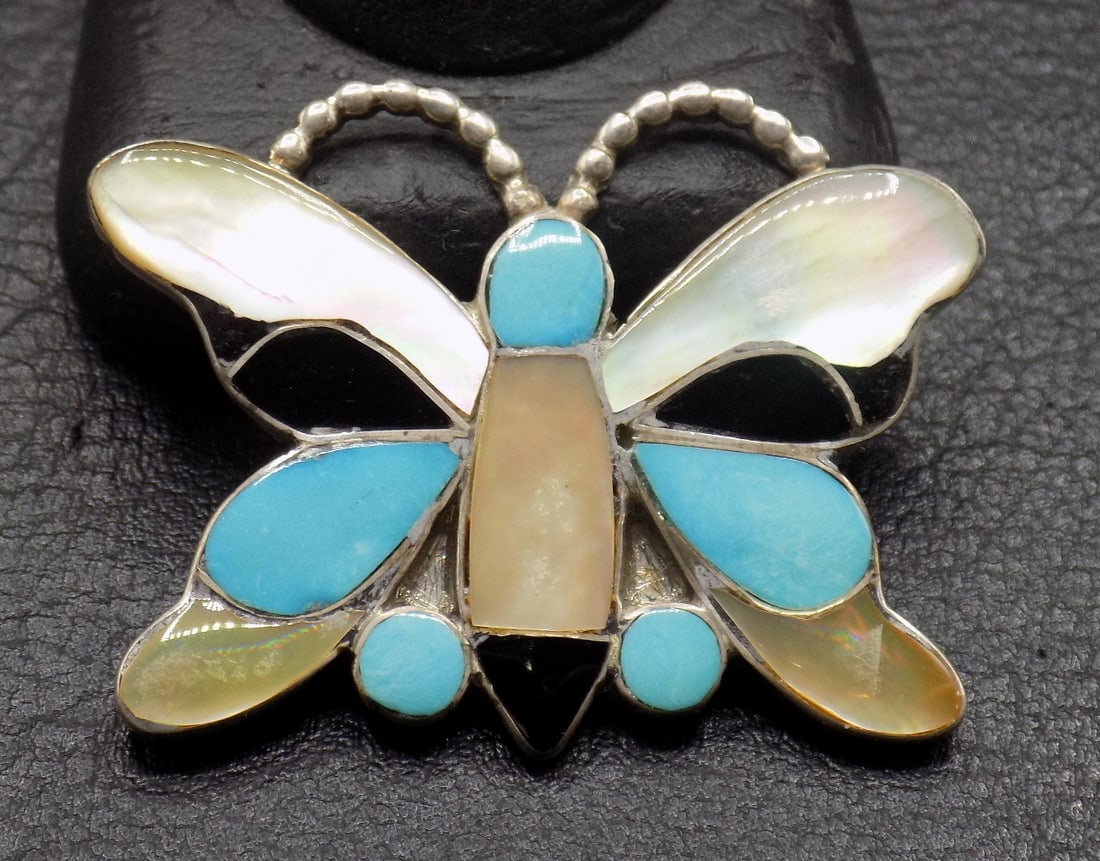 Native American Indian turquoise, mother of pearl and jet sterling silver butterfly: Native American Indian turquoise, mother of pearl and jet sterling silver butterfly. Marked Zephier as shown in photo. For Mitchell Zephier Sr. Lakota tribe. May have been a broach, please see photos.