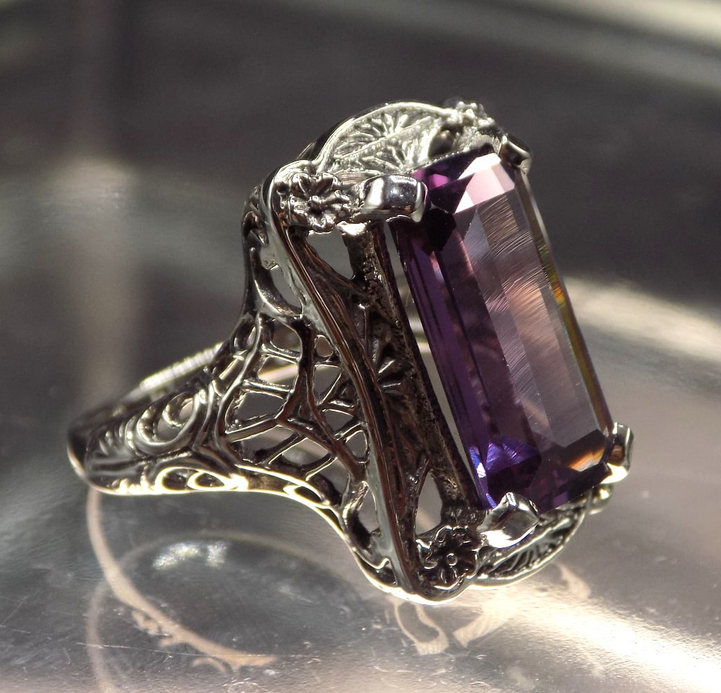 Beautiful 10 ct pink sapphire sterling silver ring: Beautiful 10 ct pink sapphire sterling silver ring. Lab created. Size 5 3/4. For in house shipping, please call Mike at Thriftiques 319-321-0613
