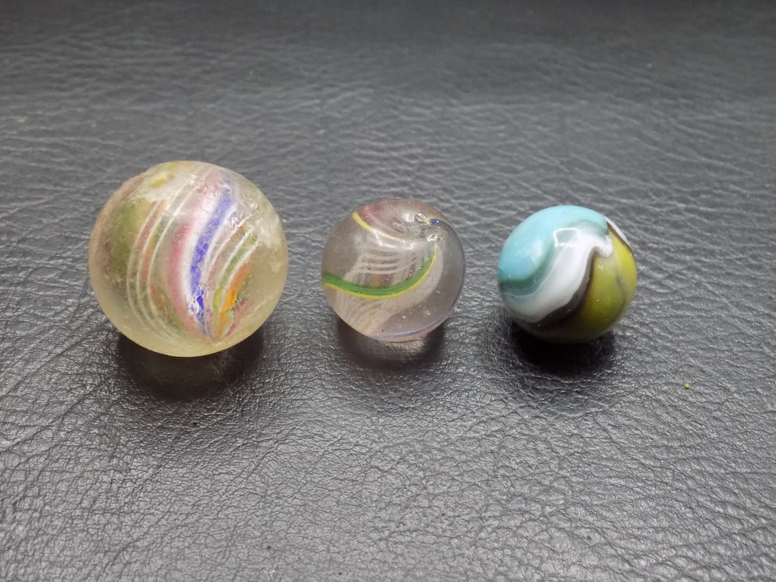 Three antique art glass marbles. (1 of 3)