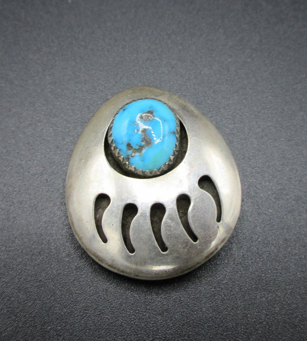 Vintage Native American Navajo sterling and turquoise bear paw shadowbox pendant: Vintage Native American Navajo sterling and turquoise bear paw shadowbox pendant. 1 ¼ inches tall. In very good original as found condition. Great quality and detail. 5 grams. White lines or do