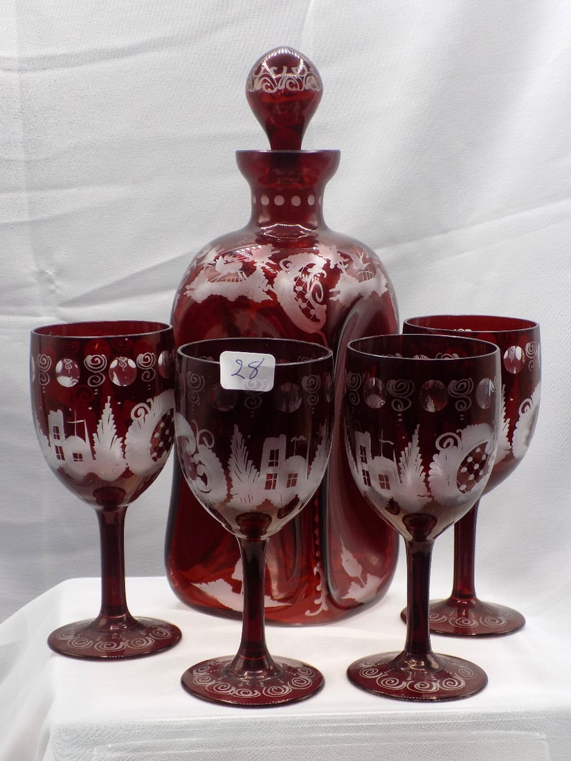 Vintage ruby red cut to clear decorated art glass liquor set: Vintage ruby red cut to clear decorated art glass liquor set. With four glass with cut clear deer and castle in forest. Beautiful colors. In very good original as found condition. Great quality and de