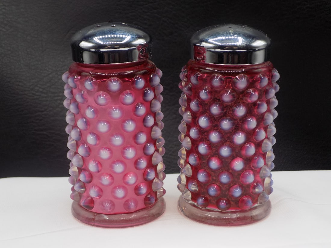 Vintage Fenton cranberry opalescent hobnail salt and pepper shakers: Vintage Fenton cranberry opalescent hobnail salt and pepper shakers. Original Label on bottom as shown in photo. Beautiful colors. In very good original as found condition. Great quality and detail. 3