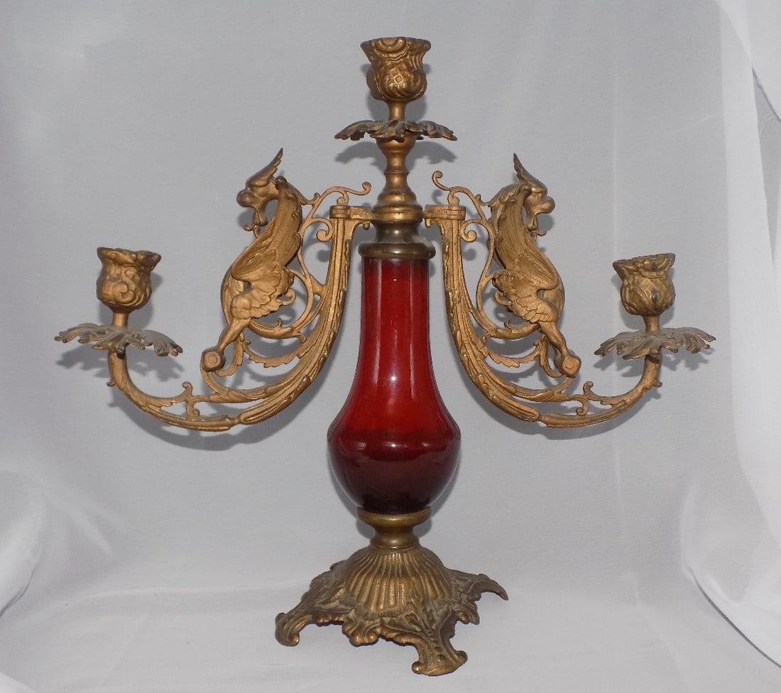 Ornate vintage bronze candelabra with mythical griffins and porcelain center: Ornate vintage bronze candelabra with mythical griffins and porcelain center. Beautiful colors. In very good original as found condition. Great quality and detail. 12 ¾ inches tall x 14 wide at