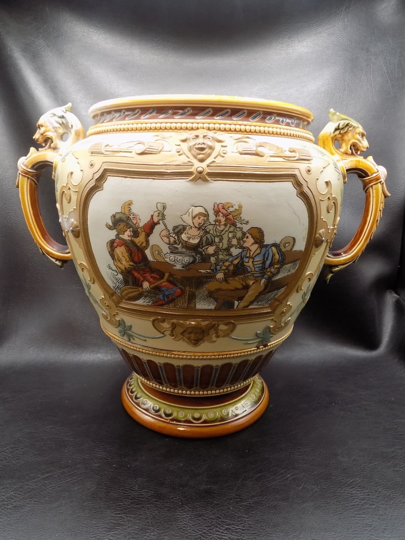 Fabulous large Mettlach jardiniere: Fabulous large Mettlach jardinière. Artist initials as shown in photo. Lion or gargoyle handles. Beautiful colors. In very good original as found condition with light stain on inside as shown in phot