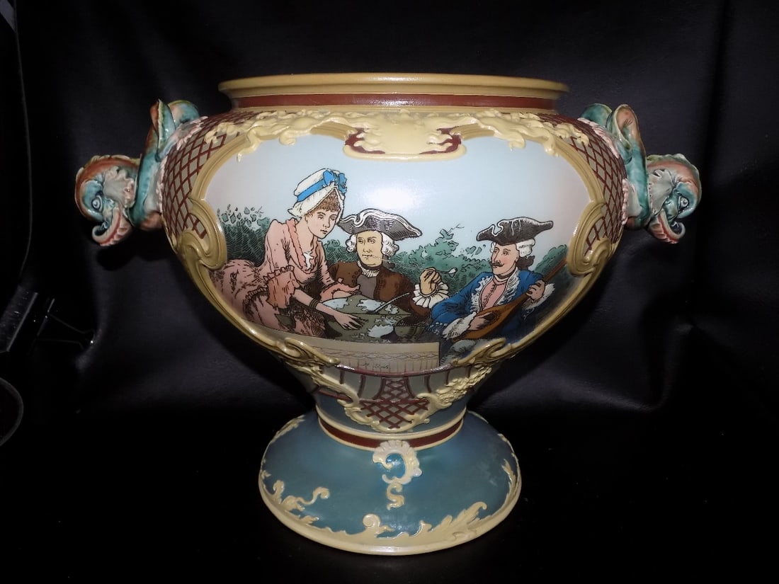 Fabulous large Mettlach jardini?re: Fabulous large Mettlach jardinière. Artist initials as shown in photo. Dolphin handles. Beautiful colors. In very good original as found condition with light stain on inside of rim as shown in ph