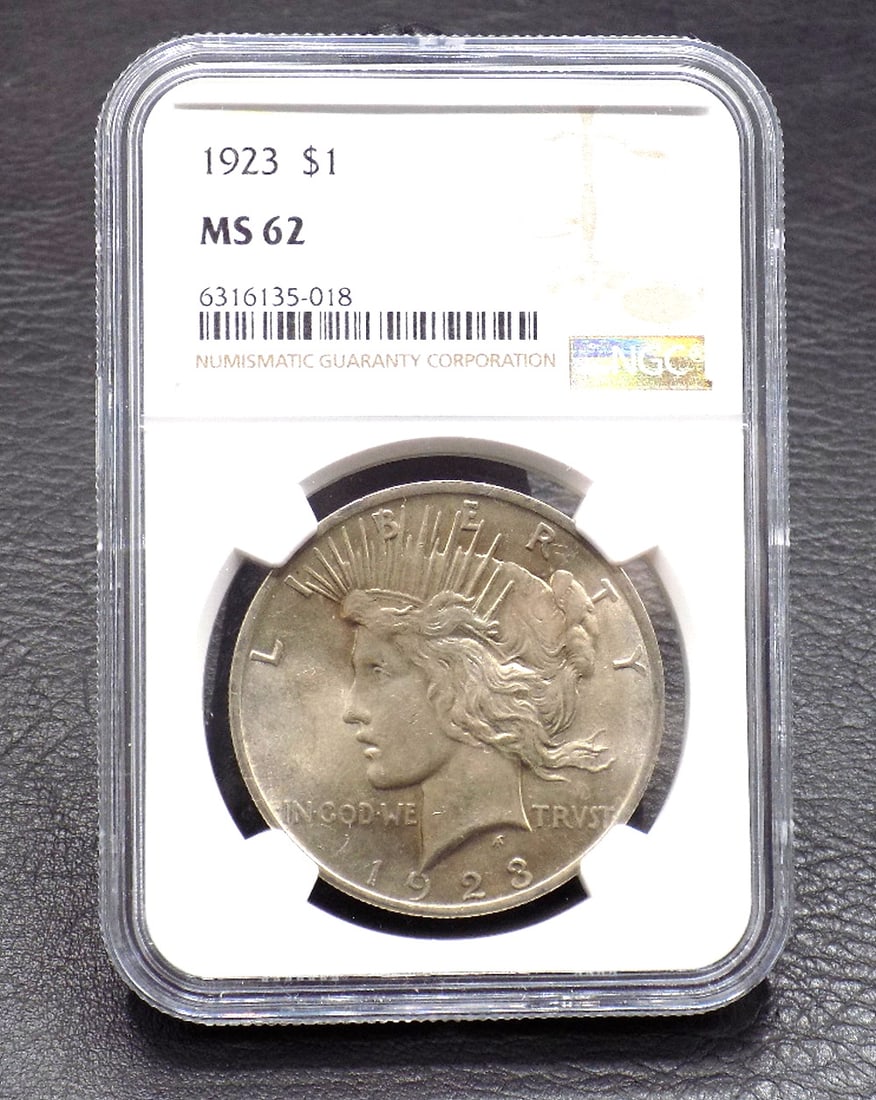 Uncirculated 1923 silver dollar MS 62 graded by NGC: Uncirculated 1923 silver dollar MS 62 graded by NGC. Please see photos. For in house shipping. Please call Mike at Thriftiques 319-321-0613. Click the preferred shipping method for in house shipping