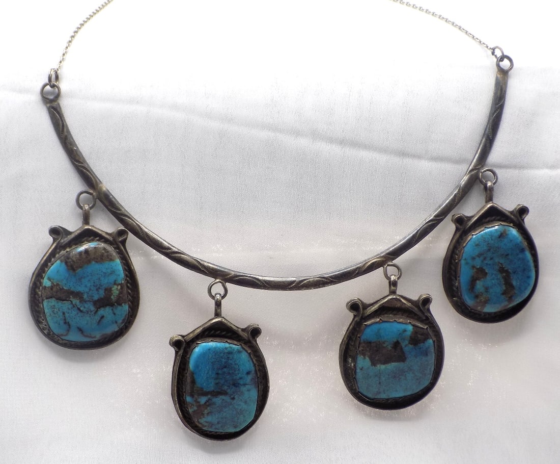 Vintage Native American turquoise and sterling silver necklace: Vintage Native American turquoise and sterling silver necklace. Stone measures 1 1/2 by 3 inches. 6 1/2 circumference 20 inches. 2.7 ounces total weight. In very good original as found condition. Grea