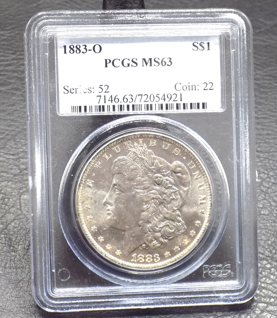 Uncirculated 1883 O silver dollar MS63 graded by PCGS (1 of 3)