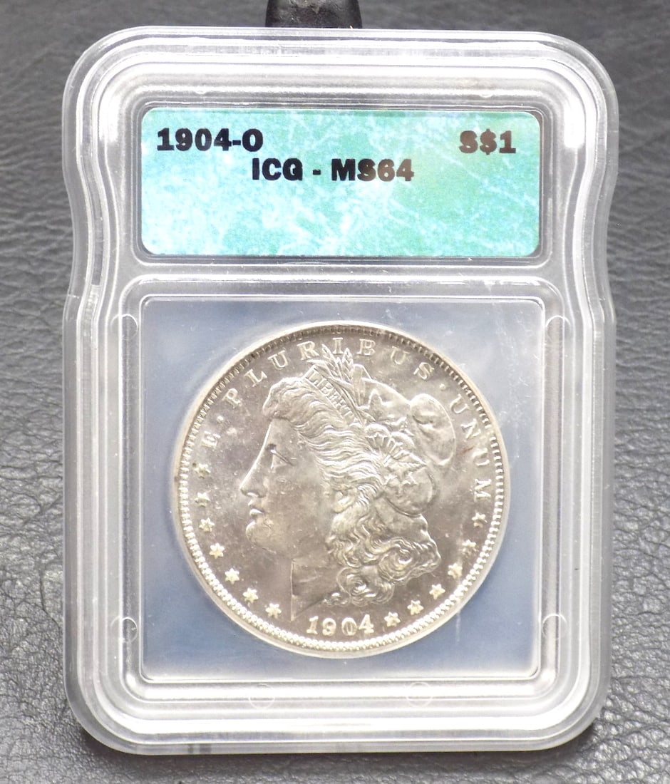 Uncirculated 1904 O silver dollar MS64 graded by ICG: Uncirculated 1904 O silver dollar MS64 graded by ICG. In very good original as found condition. Great quality and detail. For in house shipping. Please call Mike at Thriftiques 319-321 0613. Click the