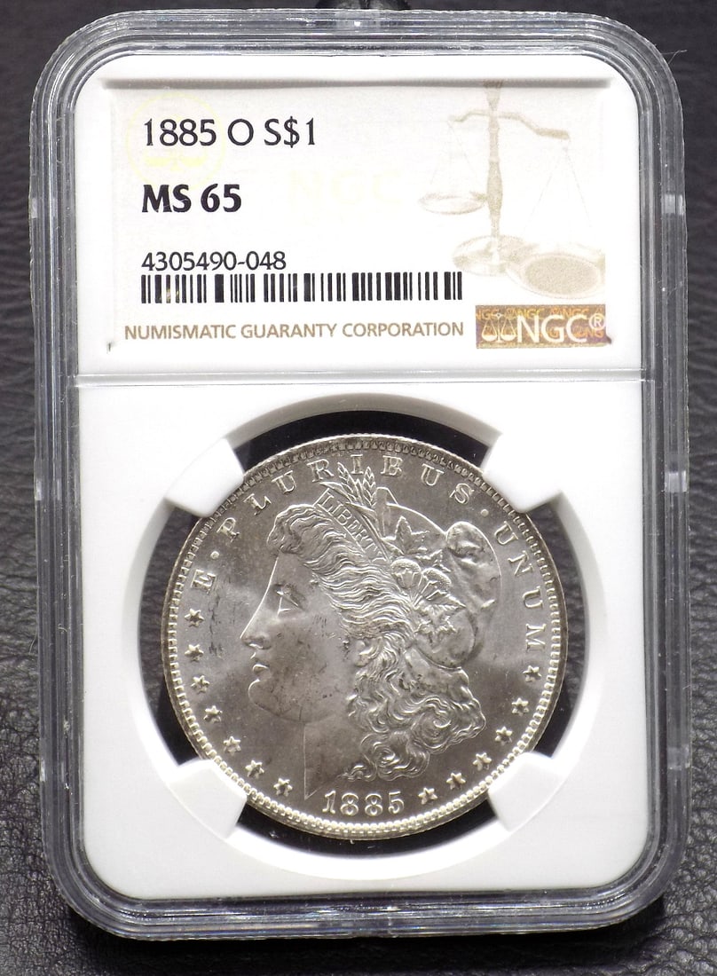 Uncirculated 1885 O silver dollar MS65 graded by NGC: Uncirculated 1885 O silver dollar MS65 graded by NGC. In very good original as found condition. Great quality and detail. For in house shipping. Please call Mike at Thriftiques 319-321 0613. Click the