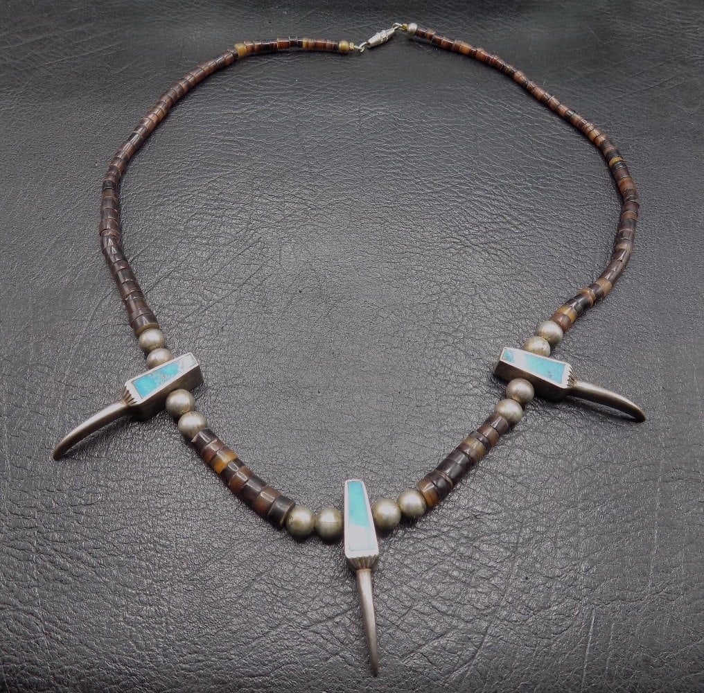 Vintage Native American turquoise, and sterling silver bear claw necklace: Vintage Native American turquoise, and sterling silver bear claw necklace. With heishi beads. Circumference 17 inches. 1.1 ounces. In very good original as found condition. Great quality and detail. F