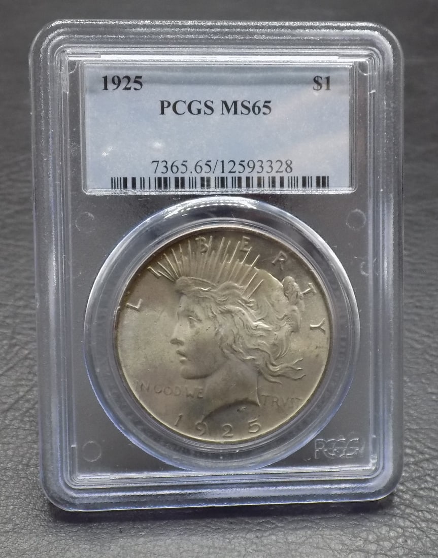Uncirculated 1925 silver dollar MS65 graded by PCGS (1 of 2)