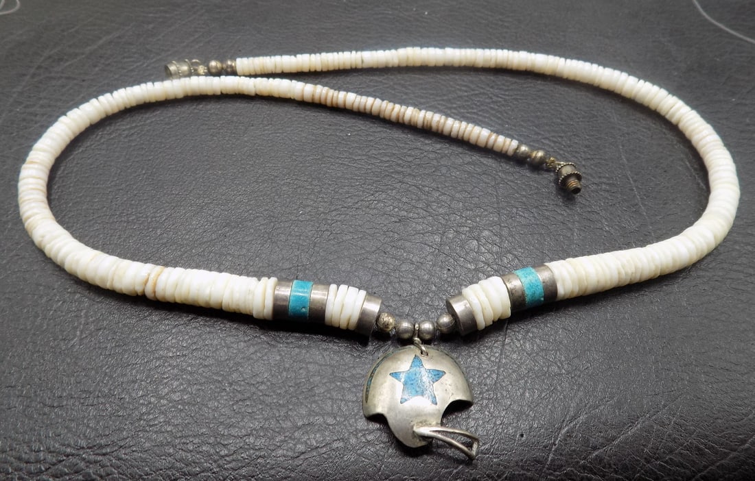 Native American Indian sterling silver turquoise and heishi necklace: Native American Indian sterling silver turquoise and heishi necklace. Has Dallas Cowboy football pendant with inlaid turquoise. Beautiful colors. In very good original as found condition. Great qualit