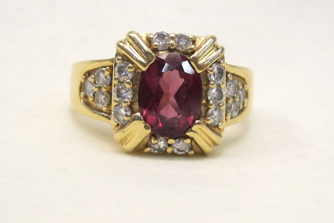 Beautiful 14 K Garnet 2 CT and Diamond Ring Size 7.: Beautiful 14 K Garnet 2 CT and Diamond Ring Size 7. Weighs 6.1 Grams.