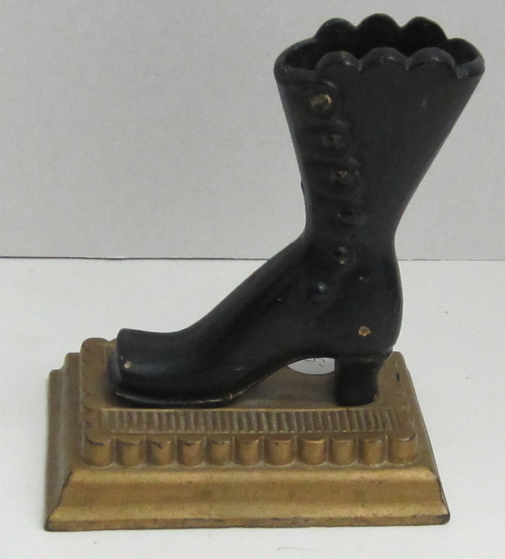 Victorian cast iron boot toothpick or match holder.: Victorian cast iron boot toothpick or match holder. 5" tall. Base approximately 4" x 3"