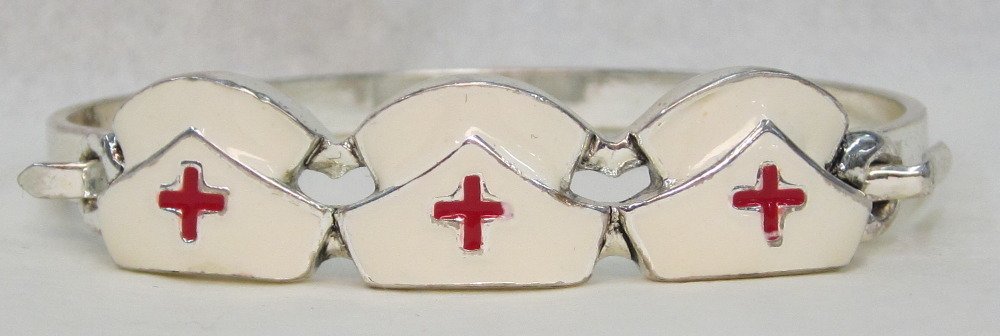Great Nurses Hats with Red Cross Bracelet Silver Tones: Great Nurses Hats with Red Cross Bracelet in silver tone. This bracelet opens at the side as shown in photos. The hats measure approximately 1/2" tall from top to bottom. Approximately 2 1/2" across w
