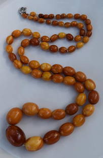 A BUTTER SCOTCH AMBER BEAD NECKLACE: A BUTTER SCOTCH AMBER BEAD NECKLACE, LENGTH: WEIGHT: