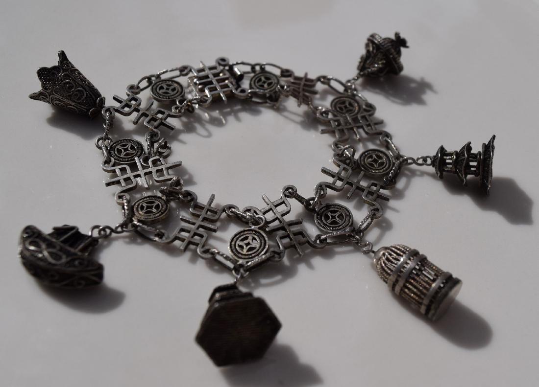 A SILVER LONGEVITY SIGN BRACELET, QING DYNASTY (1 of 5)