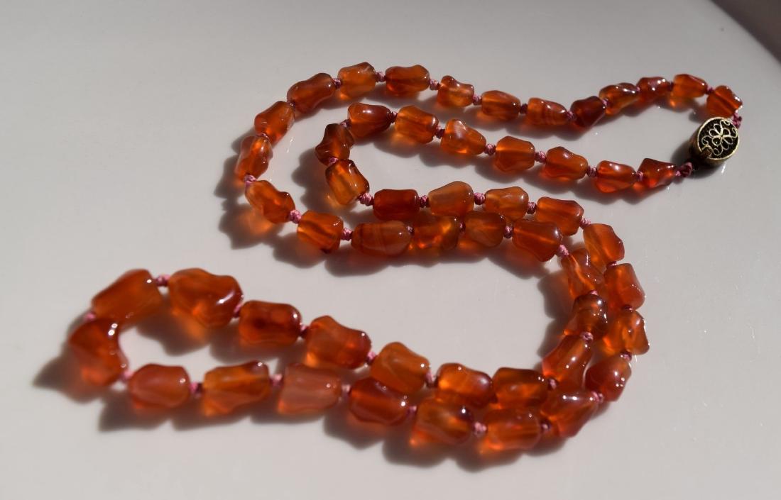 A Carnelian Bead Necklace: A Carnelian Bead Necklace, Length 24"