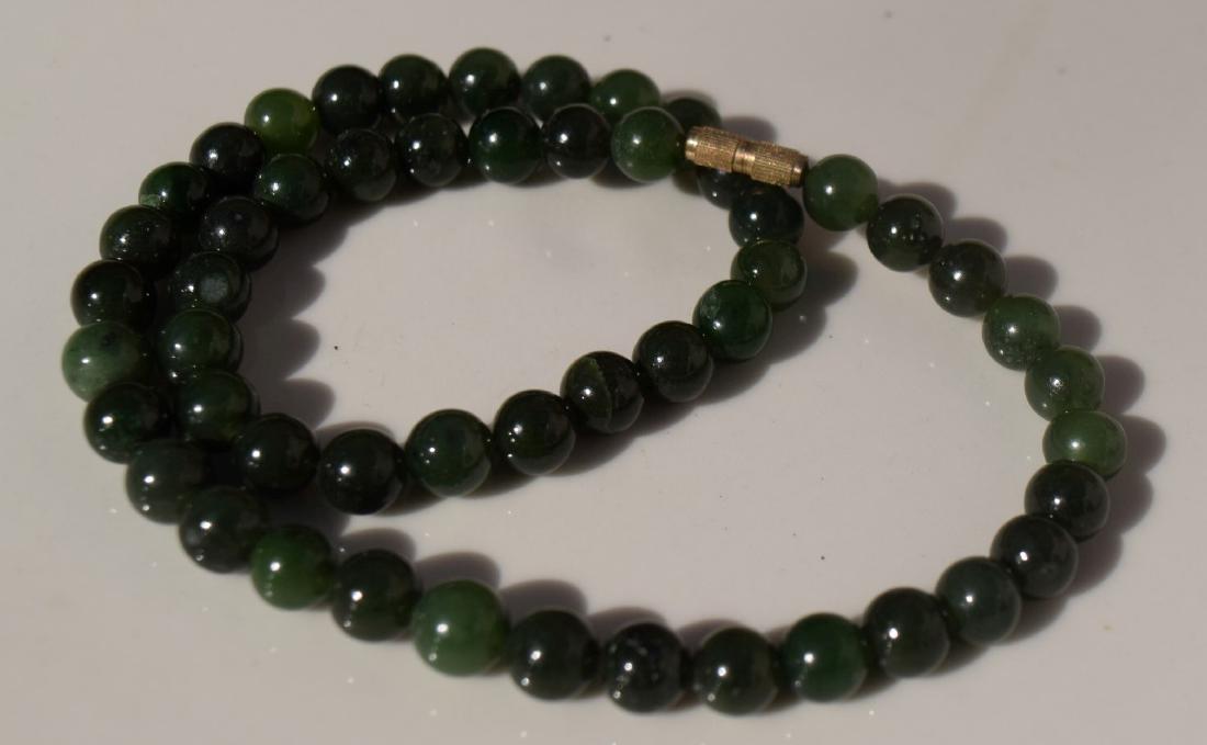 A NEPHRITE GREEN JADE BEAD NECKLACE (1 of 3)