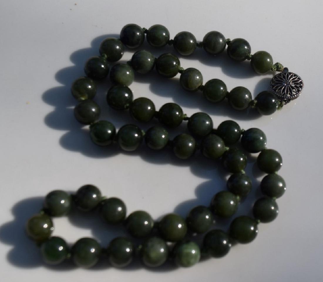 A NEPHRITE GREEN JADE BEAD NECKLACE (1 of 3)