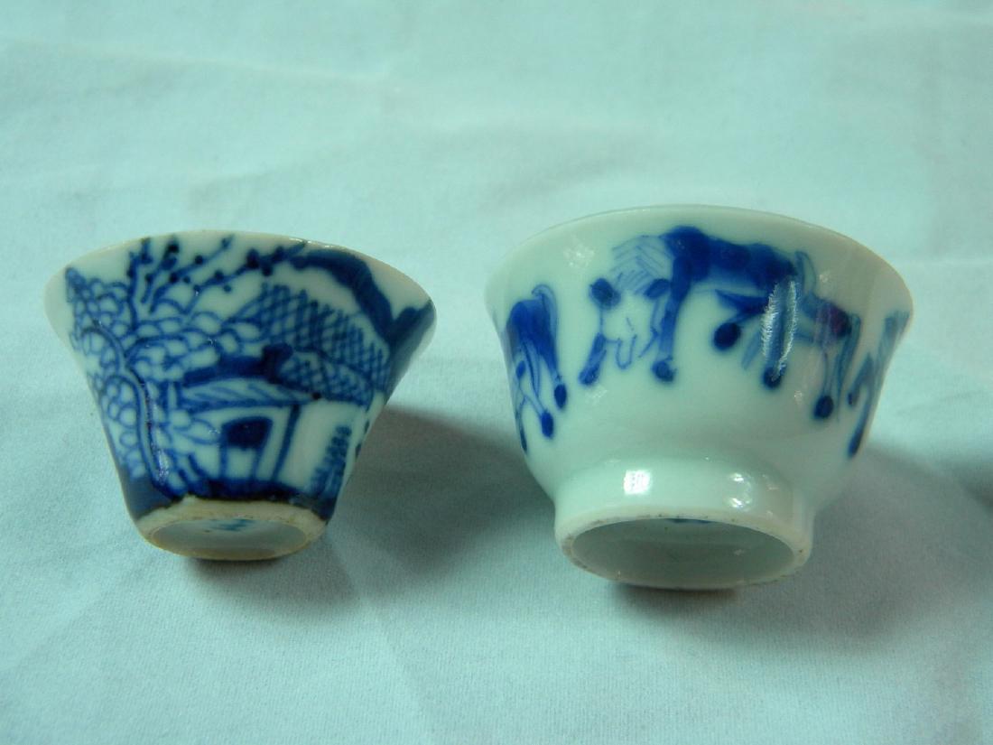 PAIR OF BLUE AND WHITE LIQUOR CUPS: PAIR OF BLUE AND WHITE LIQUOR CUPS, SIZE: 1"