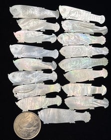 Seventeen Chinese mother-of-pearl fish shaped gaming tokens