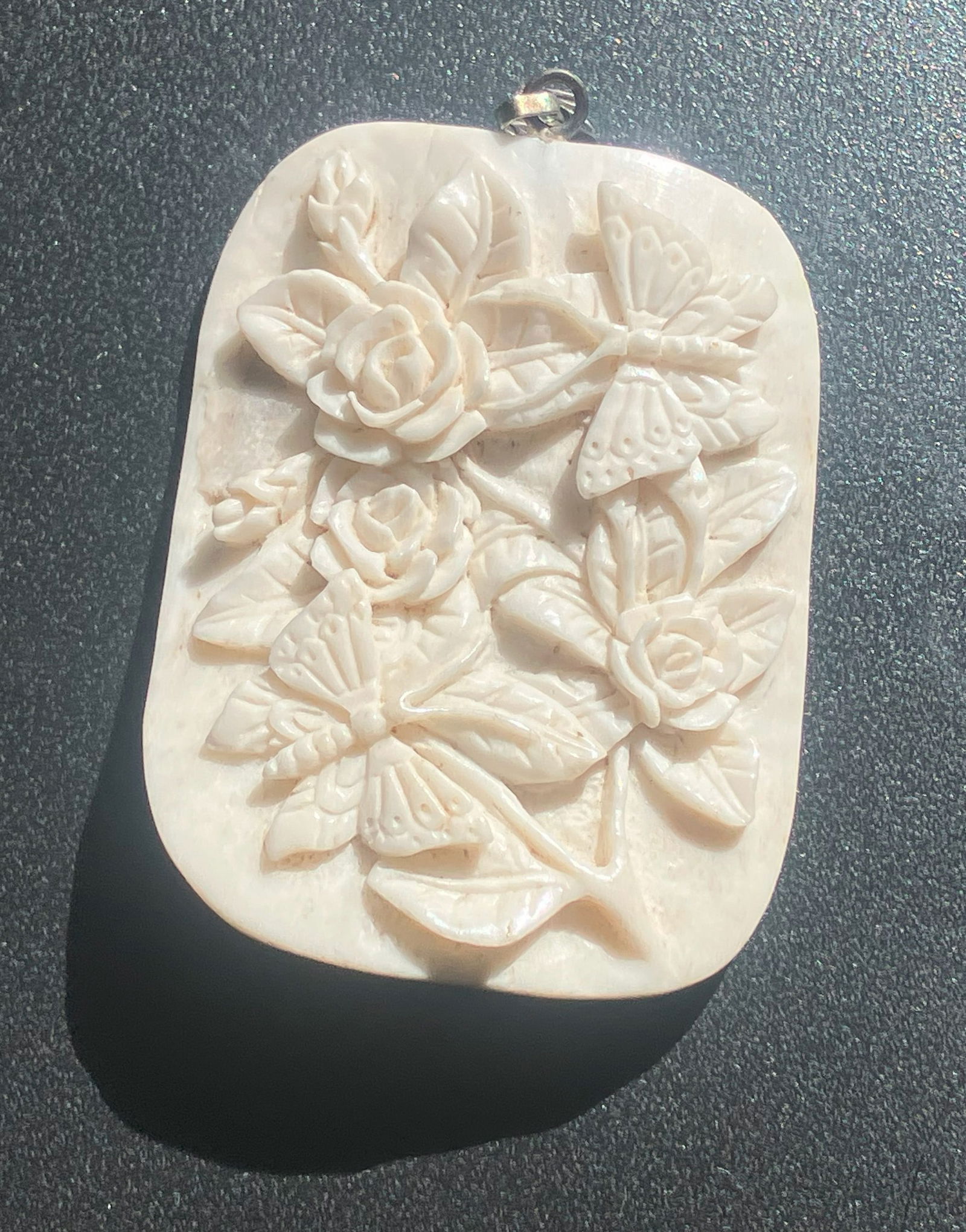 Carved Floral Bone Pendant: A beautifully carved bone pendant featuring intricate floral and butterfly designs, Size: 2.2"