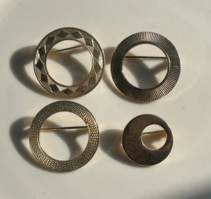 Four Brooch Pins