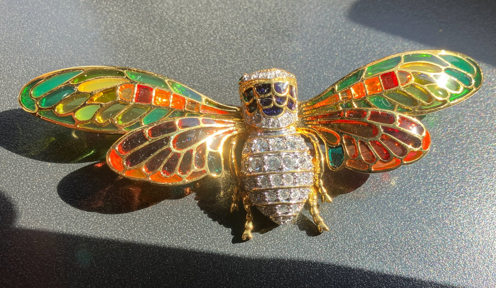 Colorful Insect Brooch: A vibrant and intricately designed insect brooch with colorful enamel wings and sparkling rhinestones. Size 3"