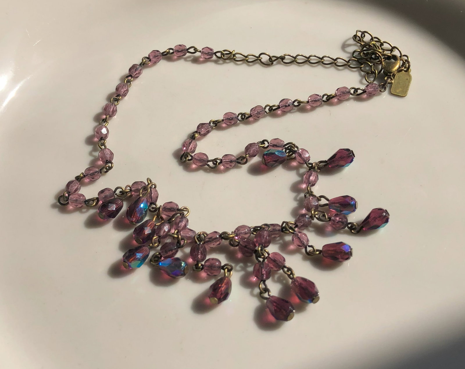 A beautiful vintage necklace with pink beads and an adjustable chain.: A beautiful vintage necklace with pink beads and an adjustable chain.