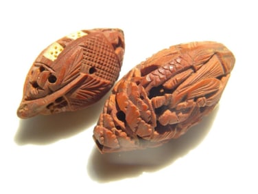 Pair of Antique Carved Pit Nut