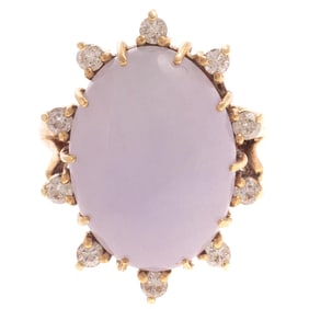 14K yellow ring featuring an oval lavender jadeite ring with 10 full cut diamonds in a raised prong