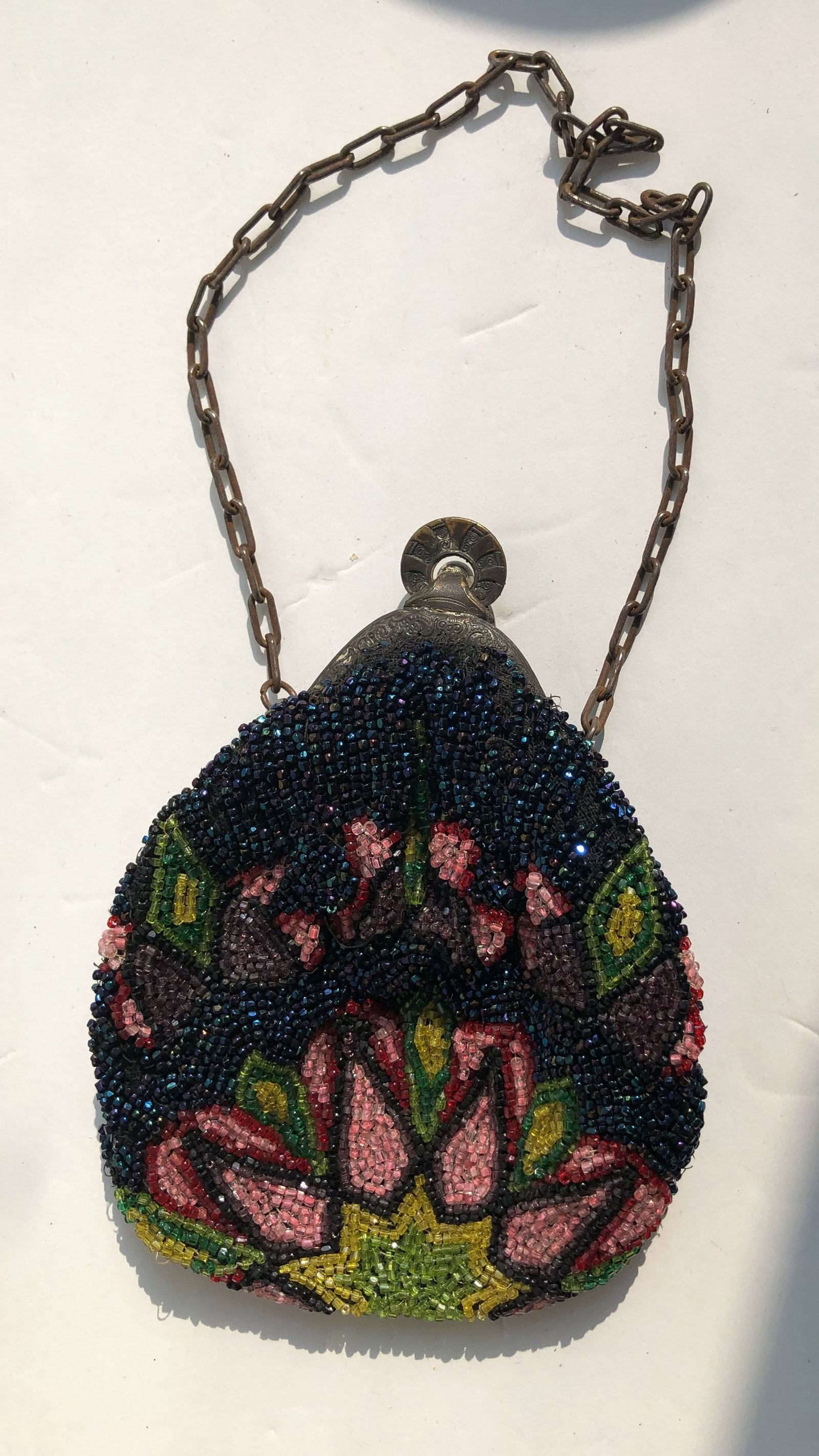 Beaded Coin Purse: A beautifully handcrafted beaded coin purse with intricate floral designs.