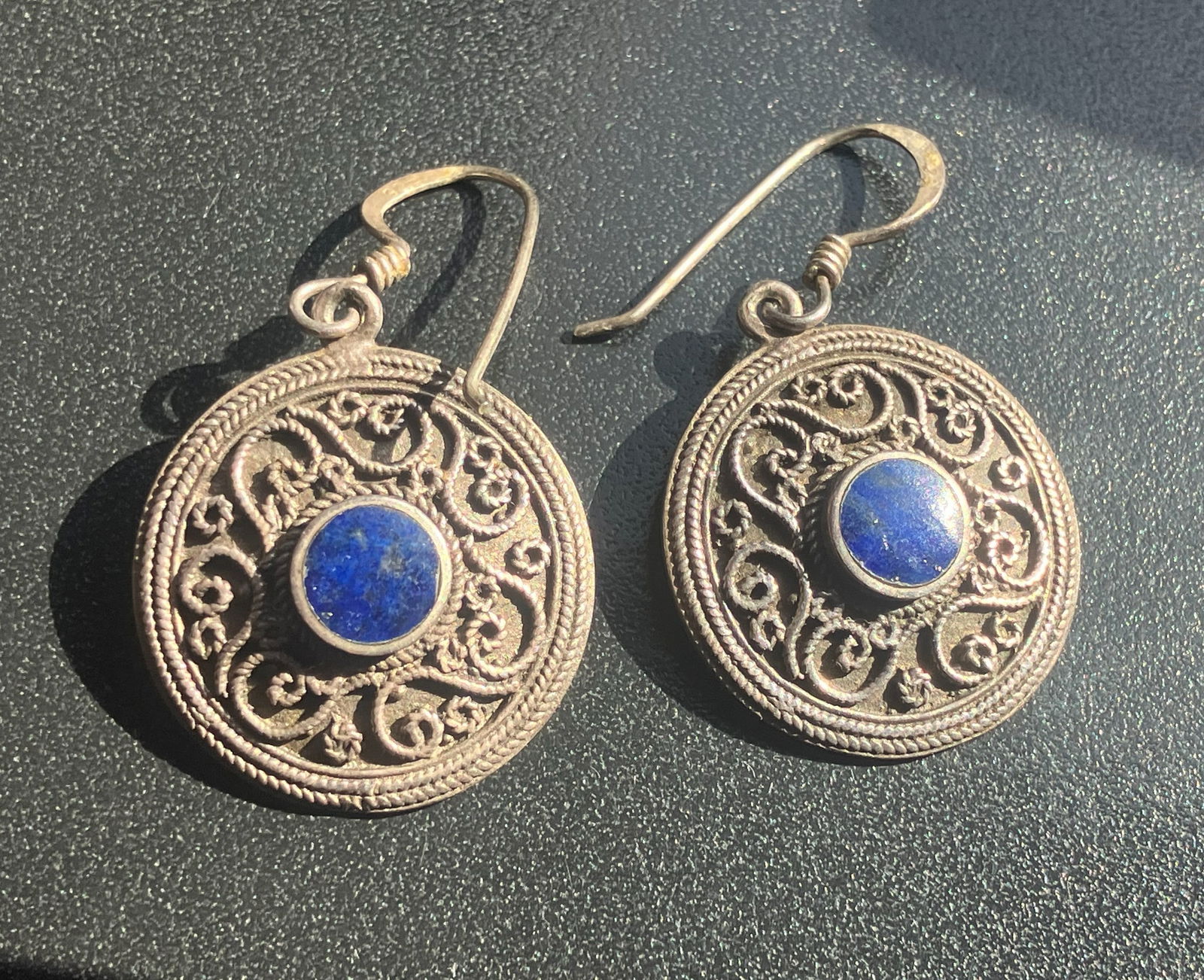Filigree Earrings with Blue Stone: Elegant filigree earrings featuring a striking blue stone centerpiece.