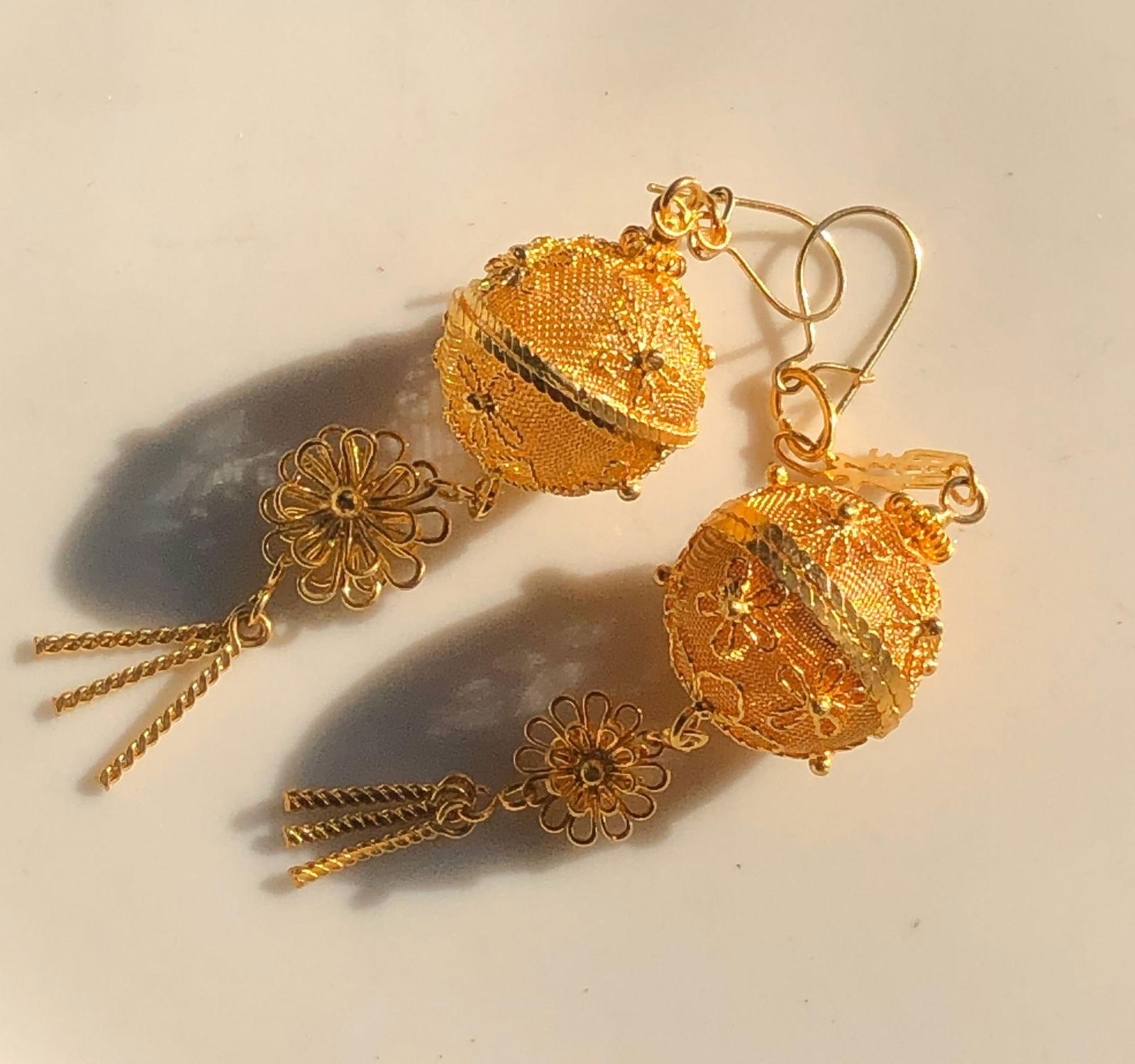 Gold Color Filigree Earrings: Elegant gold color filigree earrings with intricate floral design.