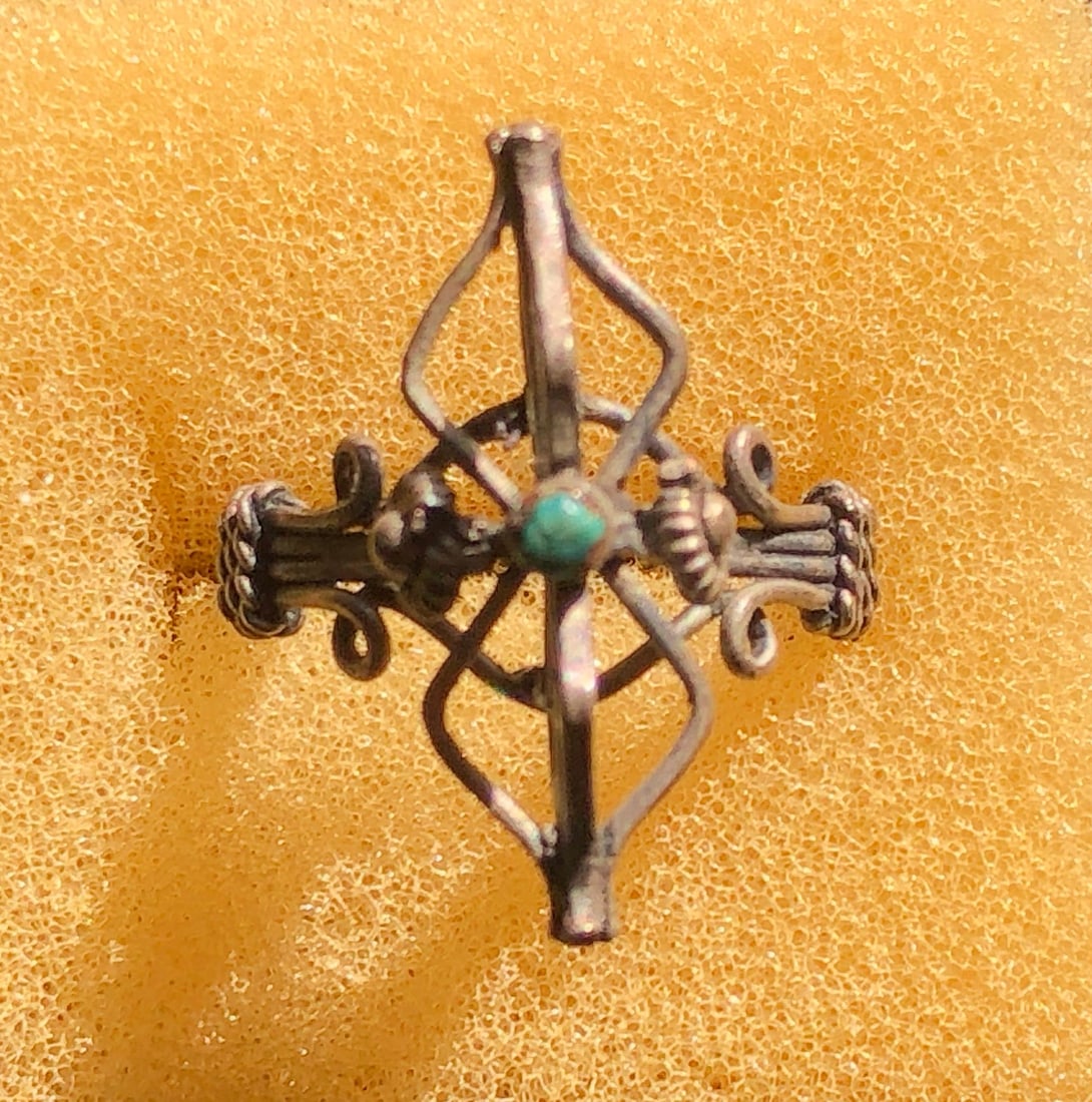 Vintage Silver Ring: A beautifully crafted vintage silver ring with intricate design and a turquoise stone. Size 6.