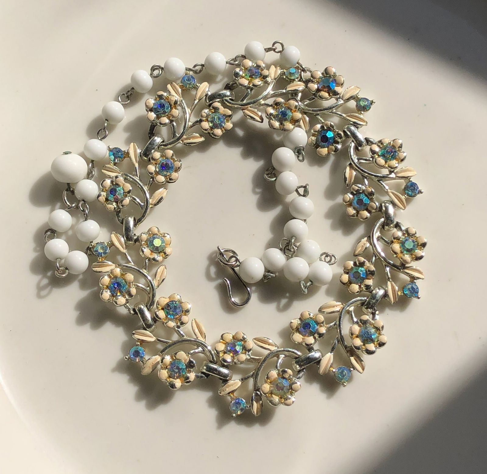 Floral Beaded Necklace: A beautiful floral beaded necklace with intricate detailing and vibrant colors.