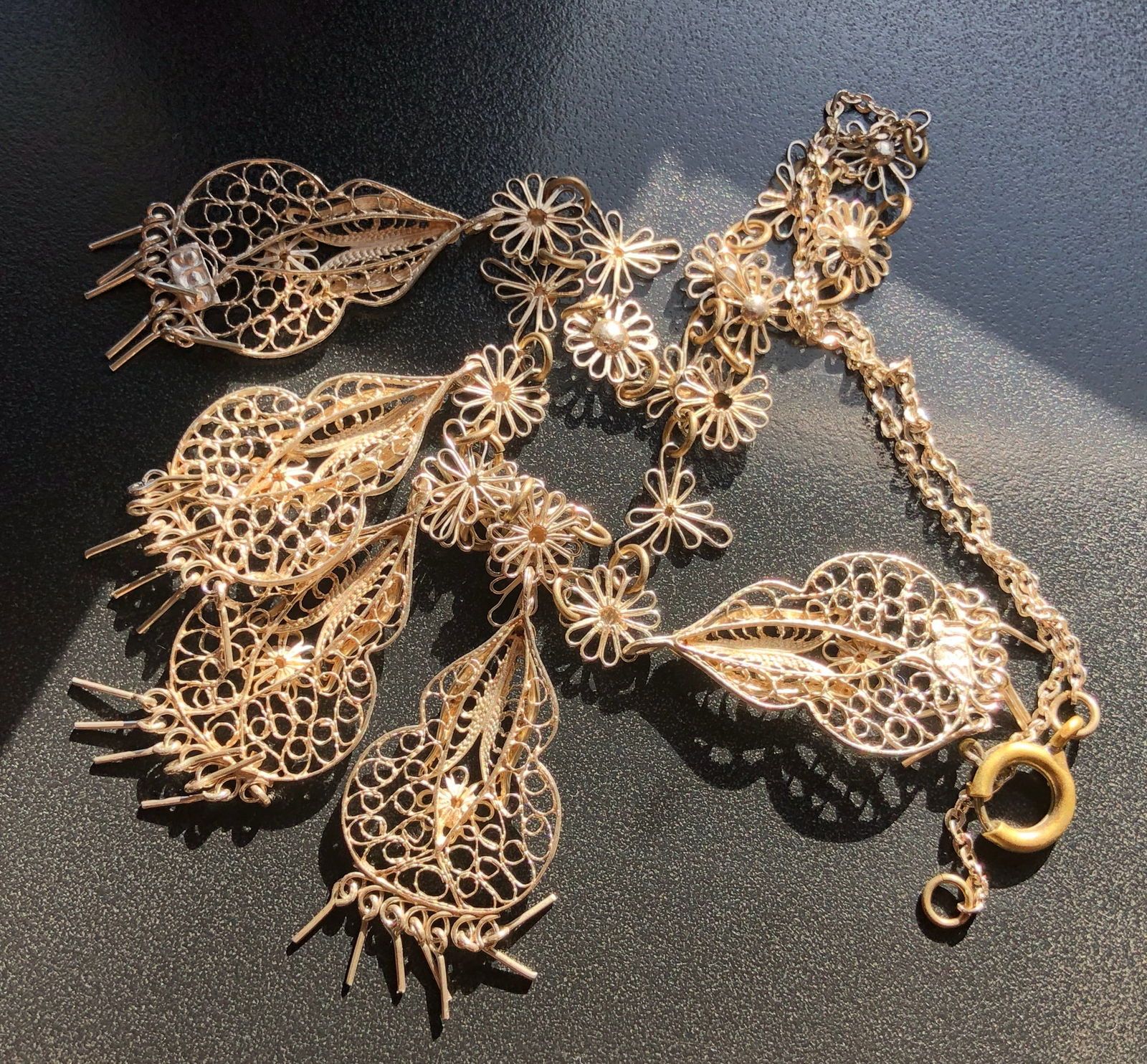 Silver Color Filigree Necklace: Elegant silver color filigree necklace with intricate floral designs.